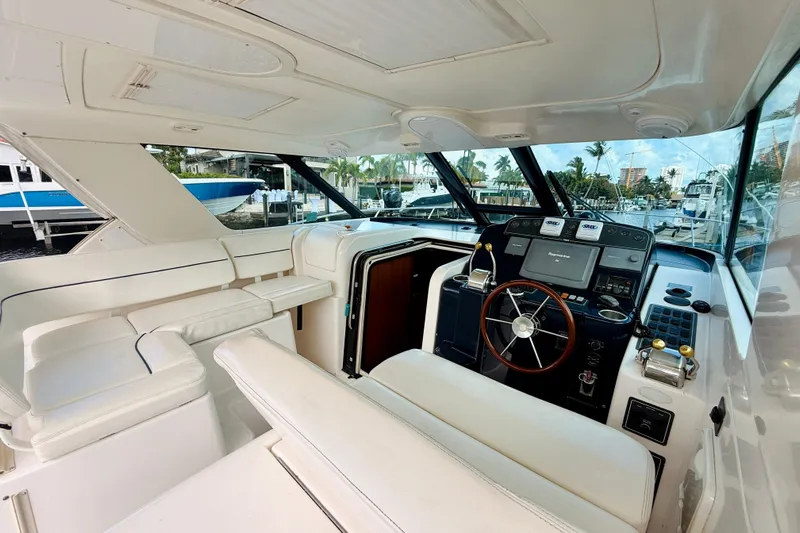 Lola Yacht Photos Pics 2005 Tiara Yachts 3600 Sovran interior with helm, seating, and navigation equipment.