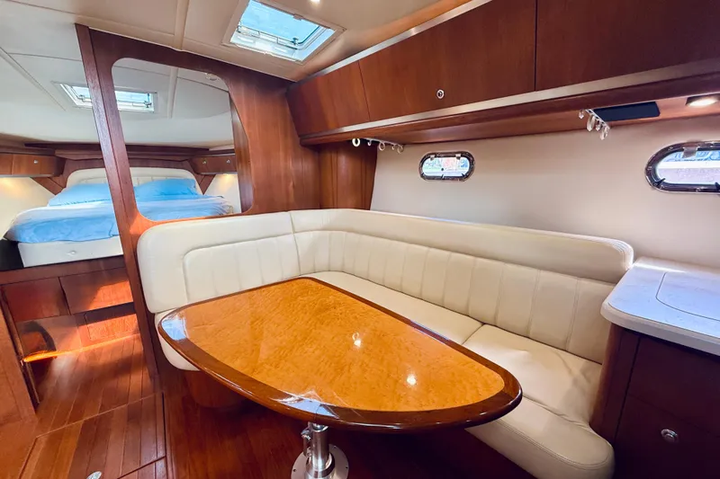 Lola Yacht Photos Pics Luxurious interior of 2005 Tiara Yachts 3600 Sovran with elegant wood and leather seating.