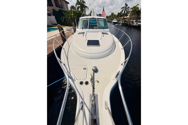 Lola Yacht Photos Pics 2005 Tiara Yachts 3600 Sovran docked, showcasing sleek design and spacious deck.