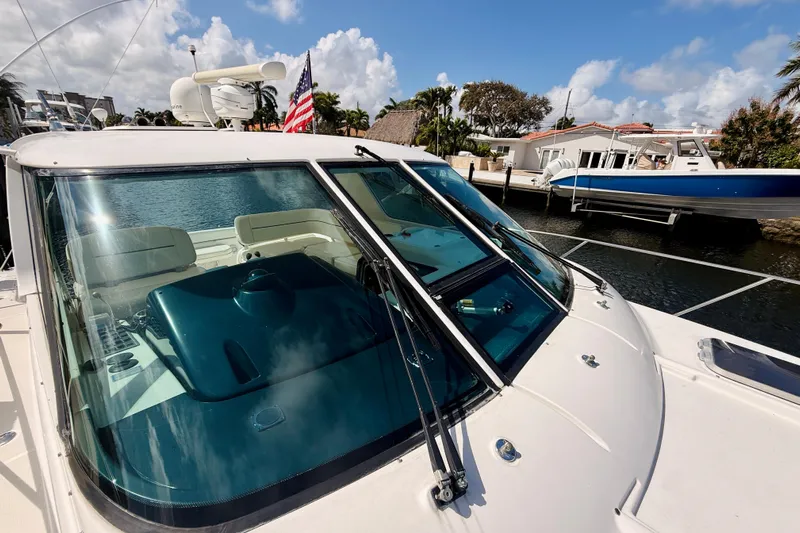 Lola Yacht Photos Pics 2005 Tiara Yachts 3600 Sovran docked, featuring sleek design and spacious cockpit.