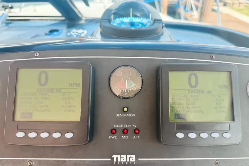 Lola Yacht Photos Pics Dashboard of a 2005 Tiara Yachts 3600 Sovran, showing engine gauges and controls.