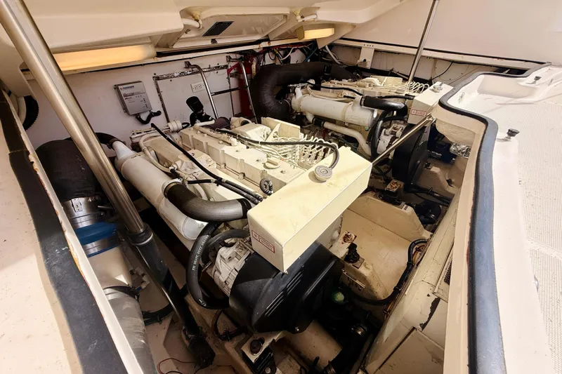 Lola Yacht Photos Pics Engine room of 2005 Tiara Yachts 3600 Sovran, showcasing dual engines and mechanical components.