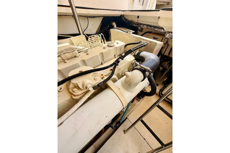 Lola Yacht Photos Pics Engine compartment of a 2005 Tiara Yachts 3600 Sovran, showcasing mechanical components.