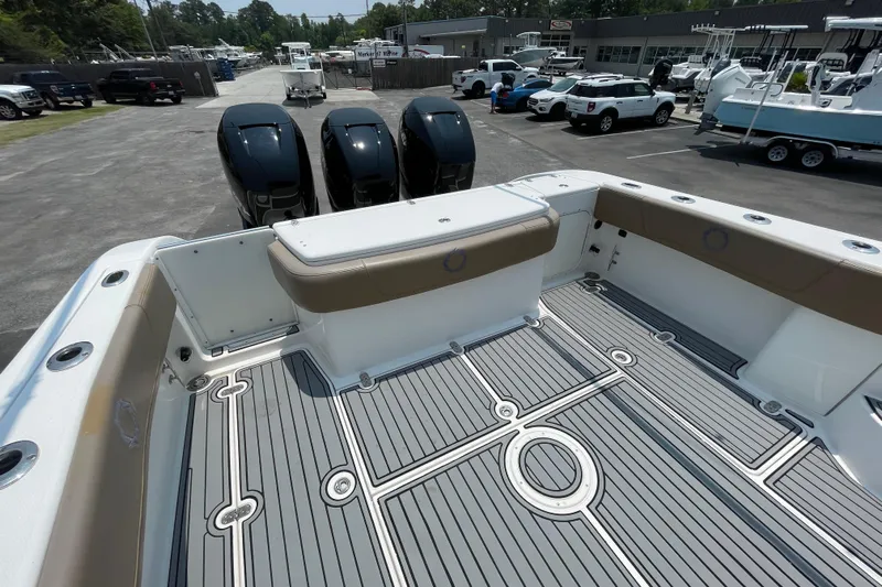  Yacht Photos Pics 2007 Fountain 38 Sportfish Cruiser OB with triple outboard engines, docked at a marina.