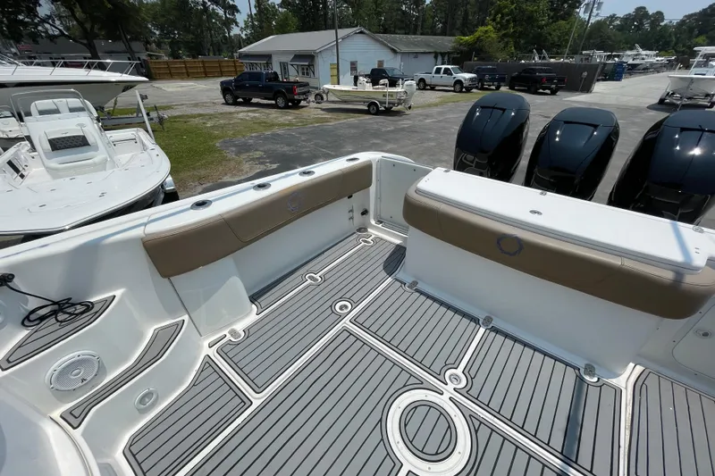  Yacht Photos Pics 2007 Fountain 38 Sportfish Cruiser OB boat interior with seating and outboard motors.