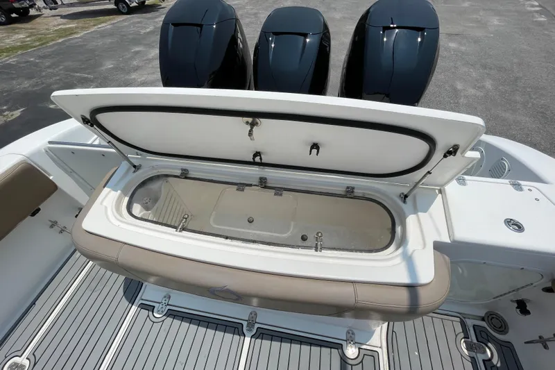  Yacht Photos Pics 2007 Fountain 38 Sportfish Cruiser OB with open storage compartment and triple outboard engines.