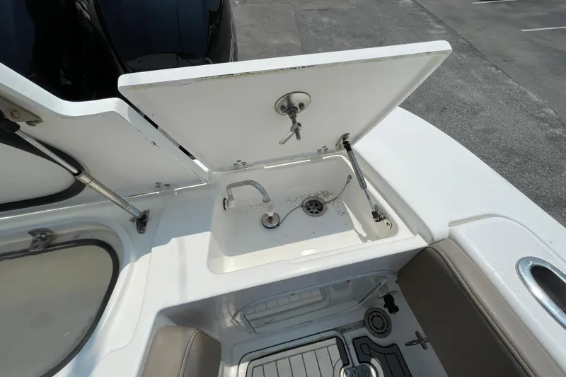  Yacht Photos Pics 2007 Fountain 38 Sportfish Cruiser OB sink and storage compartment on deck.