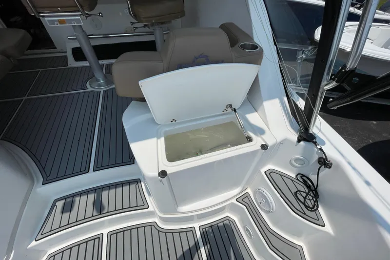  Yacht Photos Pics 2007 Fountain 38 Sportfish Cruiser OB interior with open storage compartment and seating.
