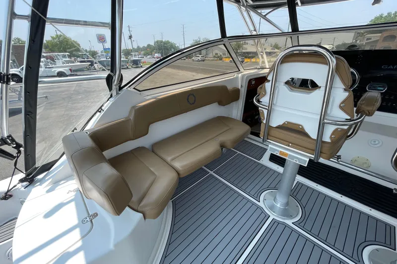  Yacht Photos Pics 2007 Fountain 38 Sportfish Cruiser OB interior with tan seating and modern helm.