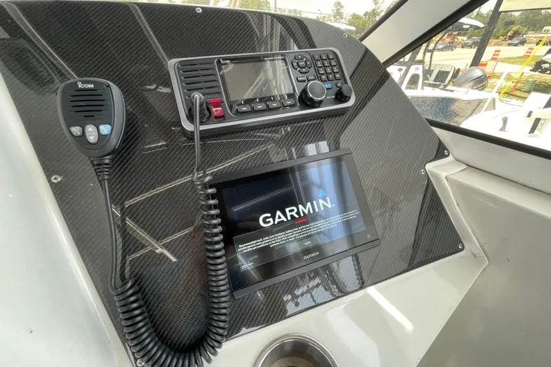  Yacht Photos Pics 2007 Fountain 38 Sportfish Cruiser OB dashboard with Garmin and Icom devices.