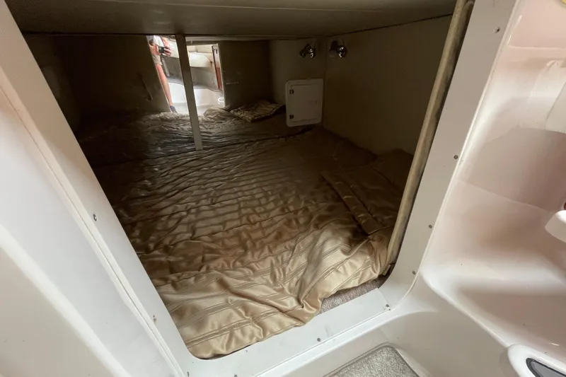  Yacht Photos Pics 2007 Fountain 38 Sportfish Cruiser OB cabin interior with bed and lighting.