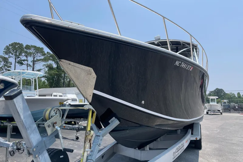  Yacht Photos Pics 2007 Fountain 38 Sportfish Cruiser OB on trailer, sleek black hull, outdoor display.