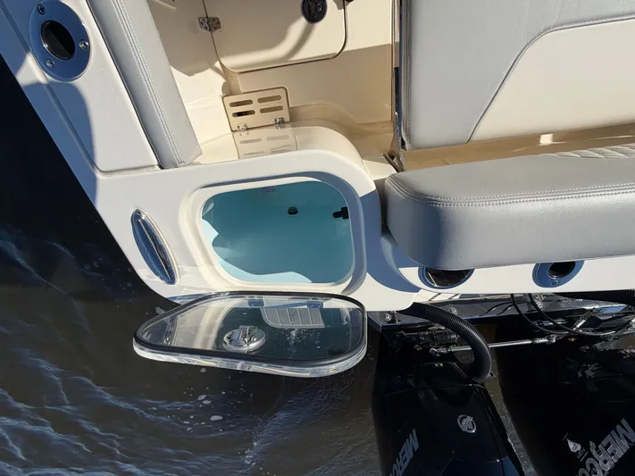  Yacht Photos Pics Scout 260 LXF 2025 boat with open storage compartment at the stern.