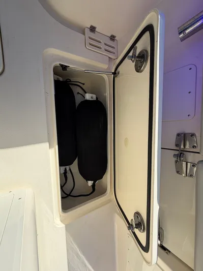  Yacht Photos Pics Scout 260 LXF 2025 boat storage compartment with fenders.