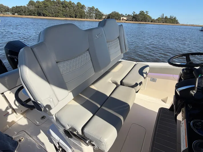  Yacht Photos Pics Scout 260 LXF 2025 boat seat by the water.