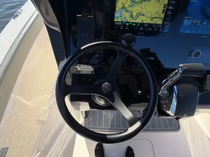  Yacht Photos Pics Scout 260 LXF 2025 helm with navigation system and controls.