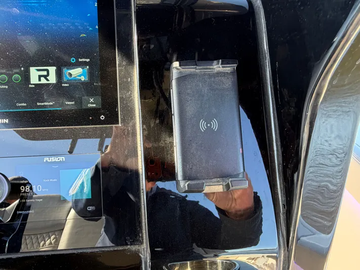  Yacht Photos Pics Scout 260 LXF 2025 boat console with touchscreen and wireless charging pad.