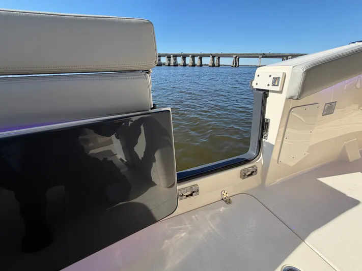  Yacht Photos Pics Scout 260 LXF 2025 boat with water and bridge view.