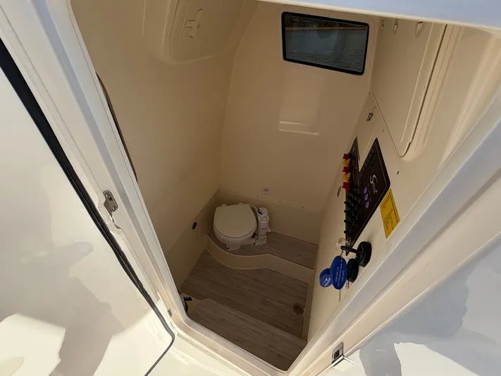  Yacht Photos Pics Interior of 2025 Scout 260 LXF featuring toilet and controls.
