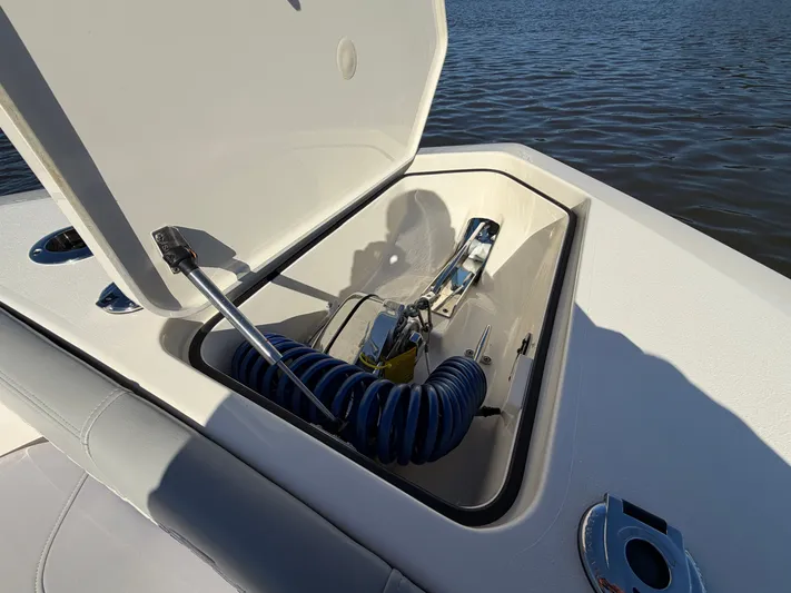  Yacht Photos Pics 2025 Scout 260 LXF boat with open storage compartment lid.