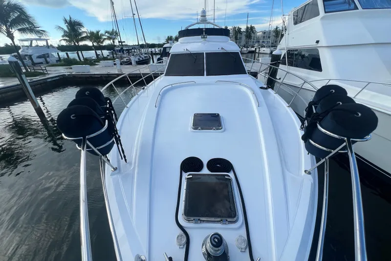  Yacht Photos Pics 2001 Jefferson International 5300 yacht docked at marina with palm trees.