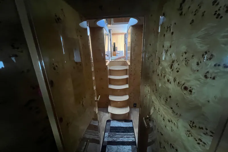  Yacht Photos Pics Interior of 2001 Jefferson International 5300 yacht with wooden staircase and luxurious design.