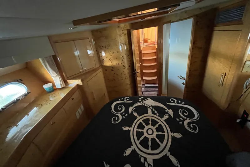  Yacht Photos Pics Luxurious cabin interior of a 2001 Jefferson International 5300 yacht with nautical-themed bedding.