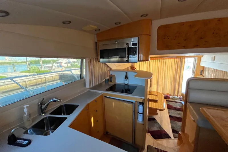  Yacht Photos Pics Luxurious kitchen interior of a 2001 Jefferson International 5300 yacht with modern amenities.
