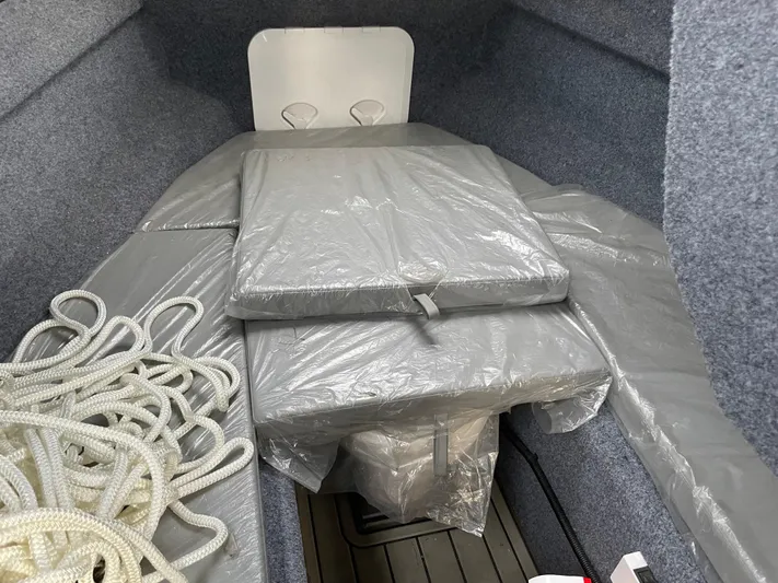  Yacht Photos Pics Interior of a 2022 custom aluminum fishing boat with cushions and rope.