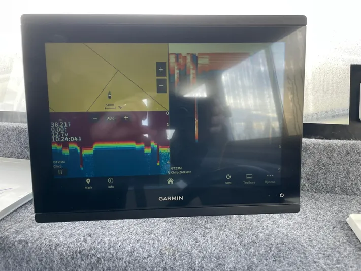  Yacht Photos Pics Garmin fish finder display on 2022 Custom Aluminum Fishing boat, showing sonar and navigation data.