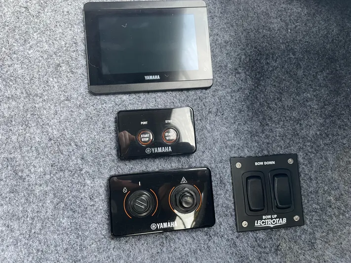  Yacht Photos Pics Control panel of a 2022 Custom Aluminum Fishing boat with Yamaha and Lectrotab components.