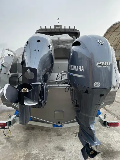  Yacht Photos Pics 2022 Custom Aluminum Fishing boat with dual Yamaha outboard motors, parked on a trailer.