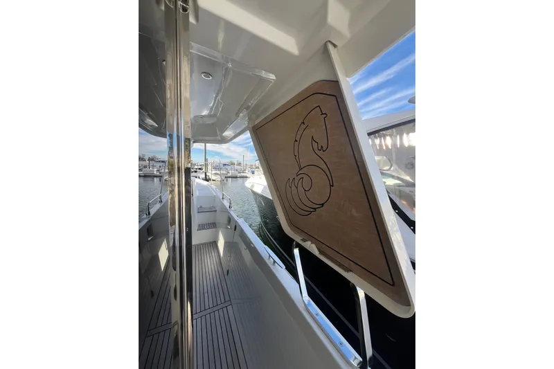  Yacht Photos Pics 2019 Beneteau Swift Trawler 35 deck view with marina background.