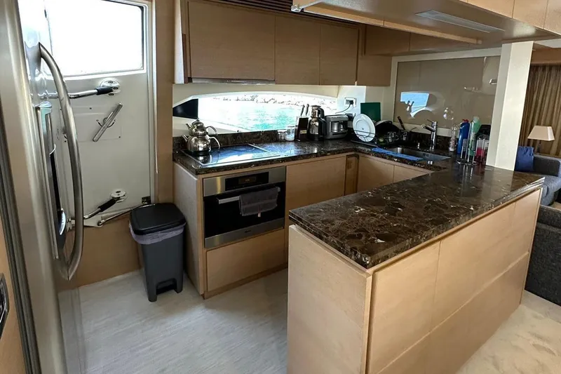  Yacht Photos Pics Modern kitchen interior on 2012 Azimut 78 yacht with sleek countertops and appliances.