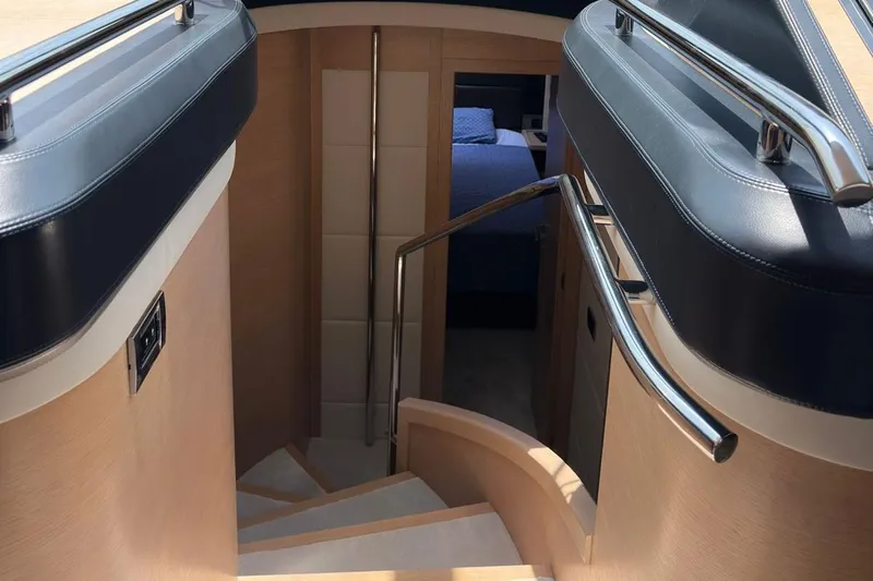  Yacht Photos Pics Interior staircase of 2012 Azimut 78 yacht, leading to a bedroom.