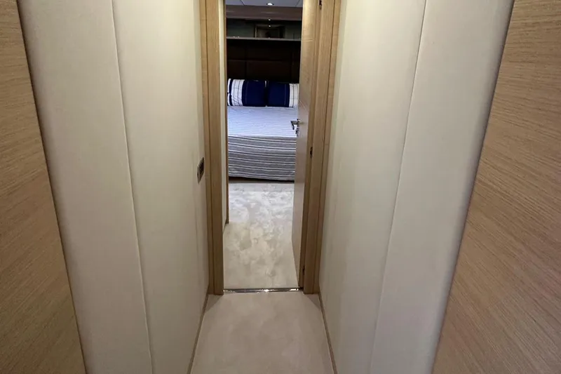  Yacht Photos Pics Hallway leading to a bedroom on a 2012 Azimut 78 yacht, featuring modern interior design.