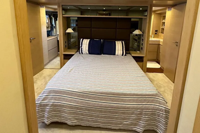  Yacht Photos Pics Luxury bedroom interior on 2012 Azimut 78 yacht with striped bedding and modern decor.