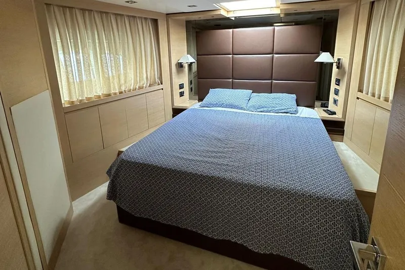  Yacht Photos Pics Luxurious bedroom interior of 2012 Azimut 78 yacht with elegant bedding and modern lighting.