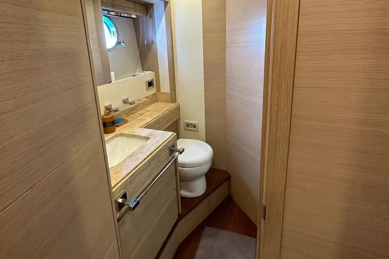  Yacht Photos Pics Luxurious bathroom interior on 2012 Azimut 78 yacht with modern fixtures and wood accents.