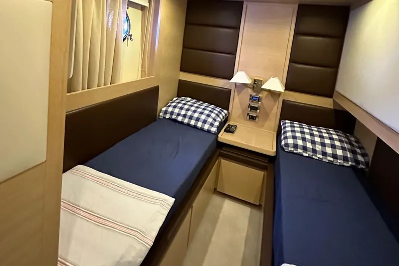  Yacht Photos Pics Twin cabin with blue bedding in 2012 Azimut 78 yacht interior.