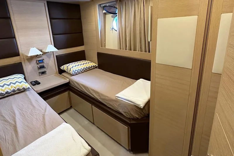  Yacht Photos Pics Luxurious cabin interior of a 2012 Azimut 78 yacht with twin beds and modern decor.