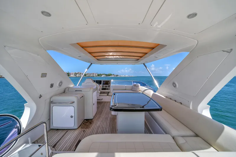  Yacht Photos Pics Luxurious 2012 Azimut 64 Flybridge yacht interior with ocean view and elegant seating.