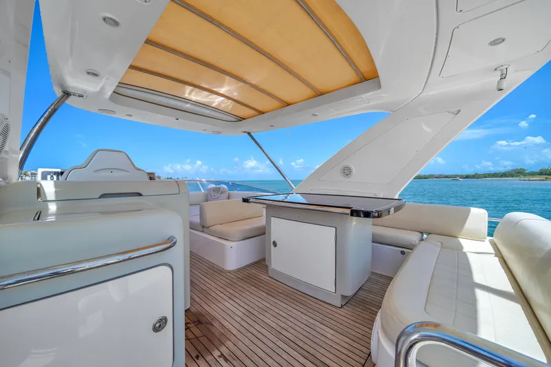  Yacht Photos Pics Luxurious 2012 Azimut 64 Flybridge yacht interior with elegant seating and ocean view.