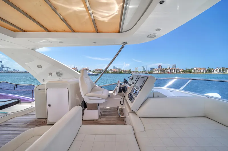  Yacht Photos Pics Luxurious 2012 Azimut 64 Flybridge yacht with spacious deck and stunning ocean view.