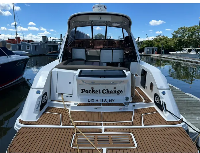 Pocket Change Yacht Photos Pics 2016 Sea Ray 370 Sundancer docked, featuring teak deck and "Pocket Change" nameplate.