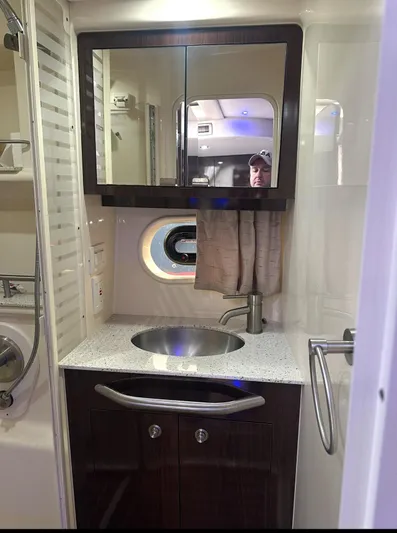 Pocket Change Yacht Photos Pics Bathroom interior of 2016 Sea Ray 370 Sundancer yacht with sink and mirror cabinet.