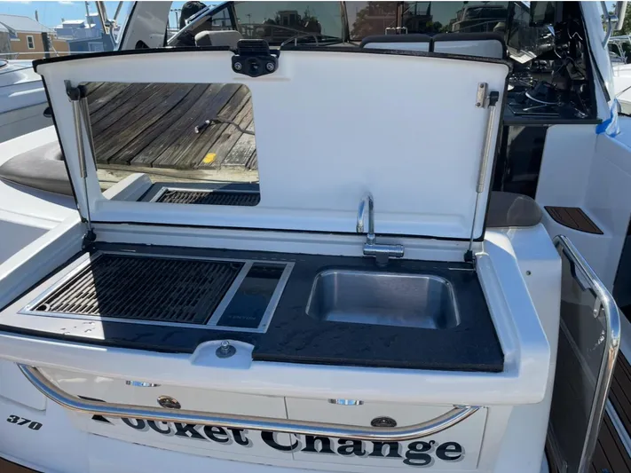 Pocket Change Yacht Photos Pics Outdoor kitchen on 2016 Sea Ray 370 Sundancer yacht with sink and grill.