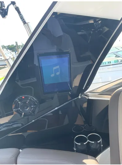 Pocket Change Yacht Photos Pics Interior of 2016 Sea Ray 370 Sundancer with touchscreen and cup holders.