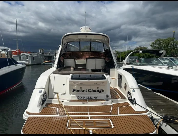 Pocket Change Yacht Photos Pics 2016 Sea Ray 370 Sundancer docked, featuring teak deck and "Pocket Change" nameplate.
