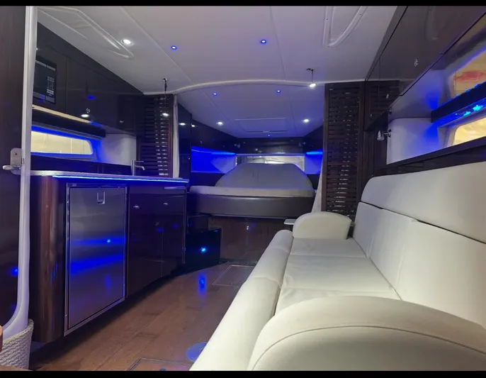 Pocket Change Yacht Photos Pics Luxurious interior of 2016 Sea Ray 370 Sundancer yacht with modern amenities and ambient lighting.